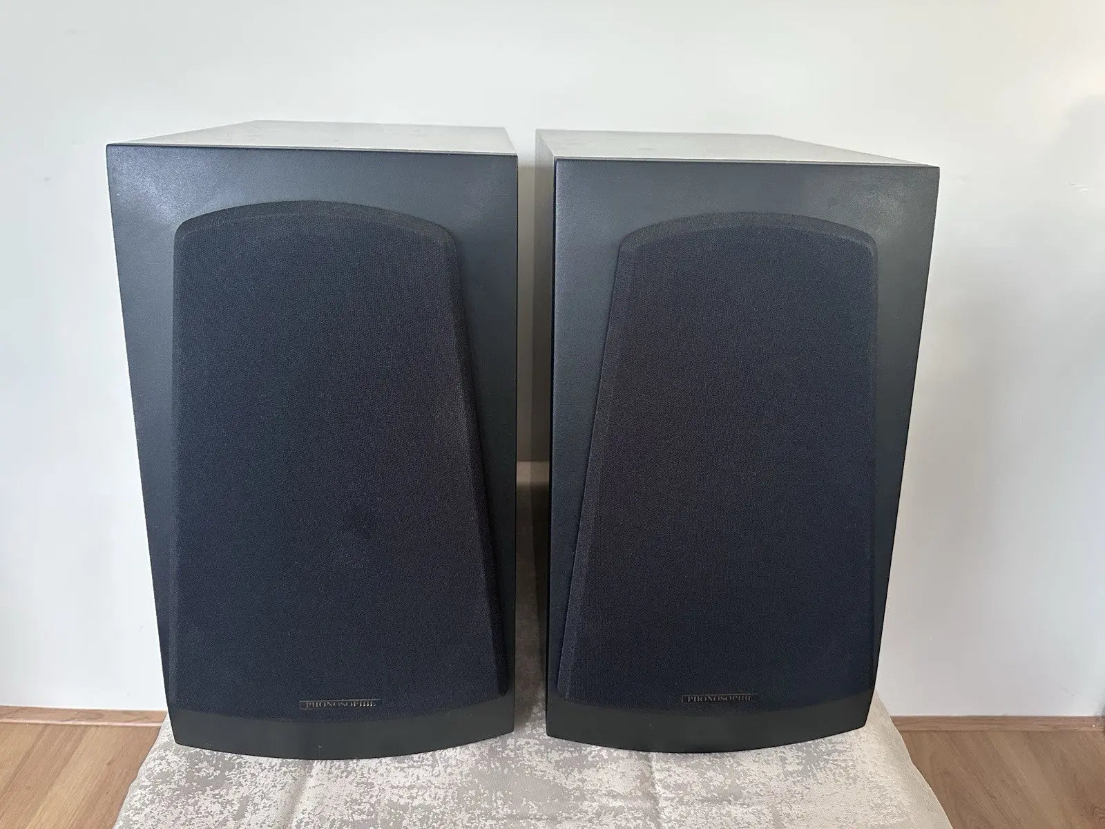 Phonosophie high‑end loudspeakers – pair with black cabinets and fabric grilles, front view
